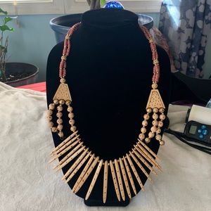Wooden beaded necklace with pink and gold accents